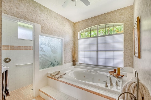 bathroom featuring plus walk in shower, tile patterned floors, and a healthy amount of sunlight