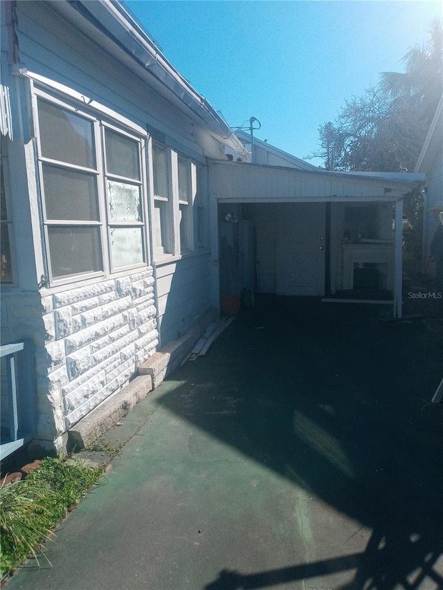 5 Palm Ave, Bradenton, FL 34208 - view of side of property with stone siding