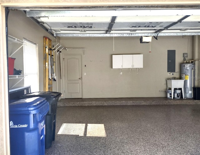 garage featuring electric panel, electric water heater, sink, and a garage door opener