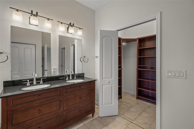 bathroom with tile patterned floors and vanity