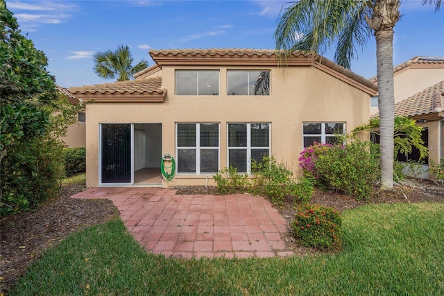 rear view of property featuring a patio