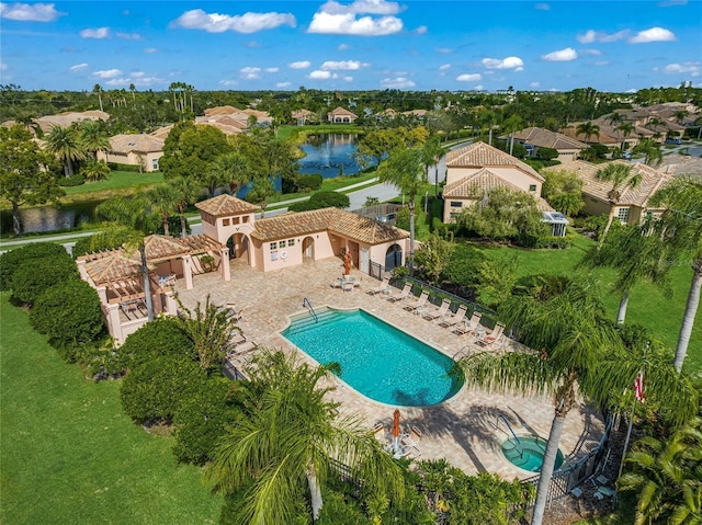 birds eye view of property with a water view