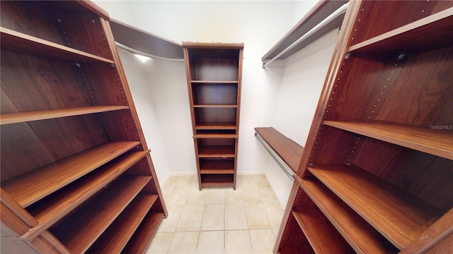 spacious closet with light tile patterned flooring