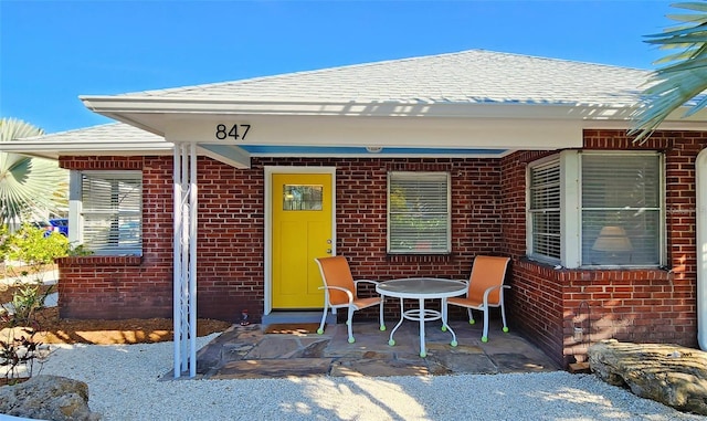 entrance to property with a patio