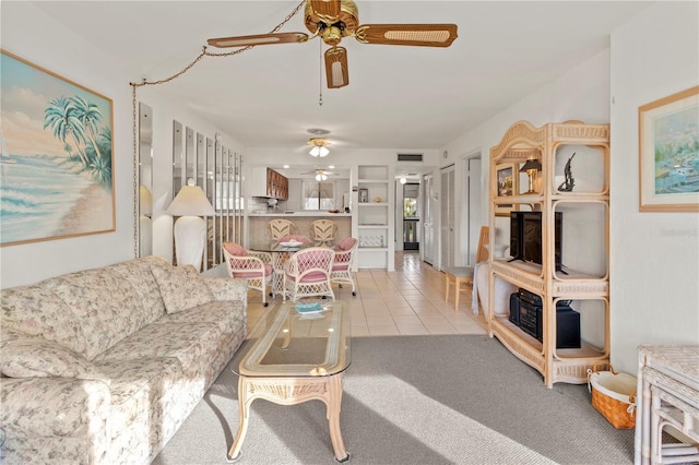 1801 Gulf Dr N Unit 222, Bradenton Beach, FL 34217 - carpeted living room with ceiling fan and tile patterned floors