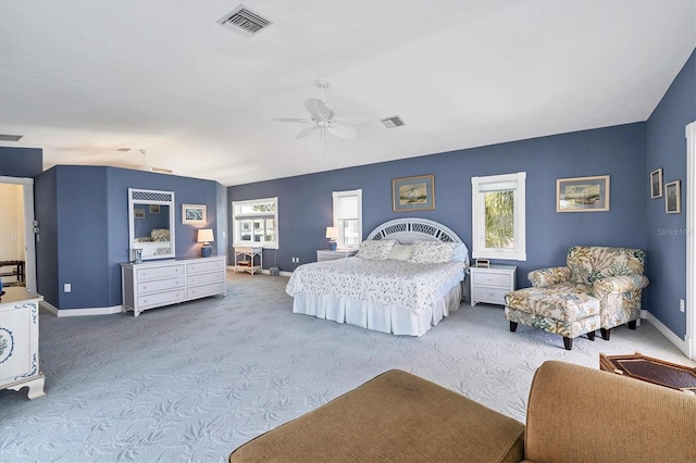 carpeted bedroom with ceiling fan and lofted ceiling