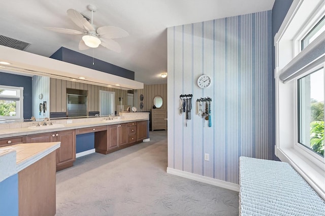 bathroom featuring vanity, a wealth of natural light, and ceiling fan