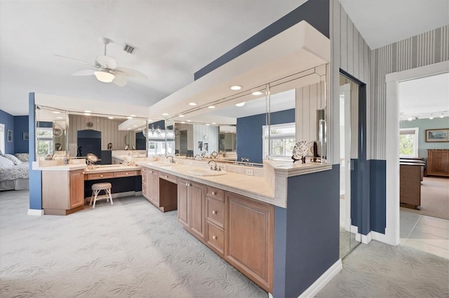 kitchen with a healthy amount of sunlight, pendant lighting, ceiling fan, and light colored carpet