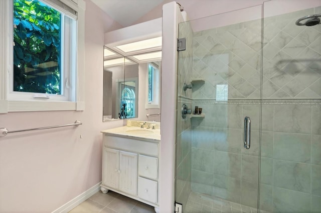 bathroom with tile patterned flooring, vanity, and an enclosed shower