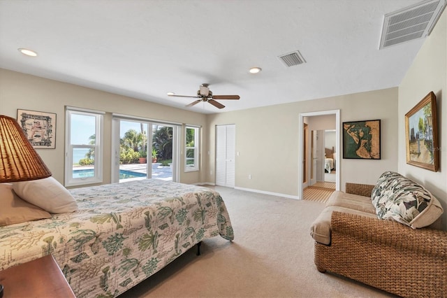 carpeted bedroom with access to exterior, a closet, and ceiling fan