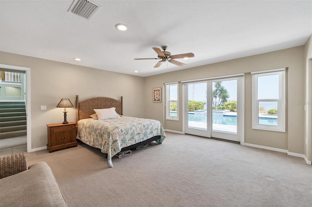 bedroom with access to exterior, ceiling fan, and light carpet