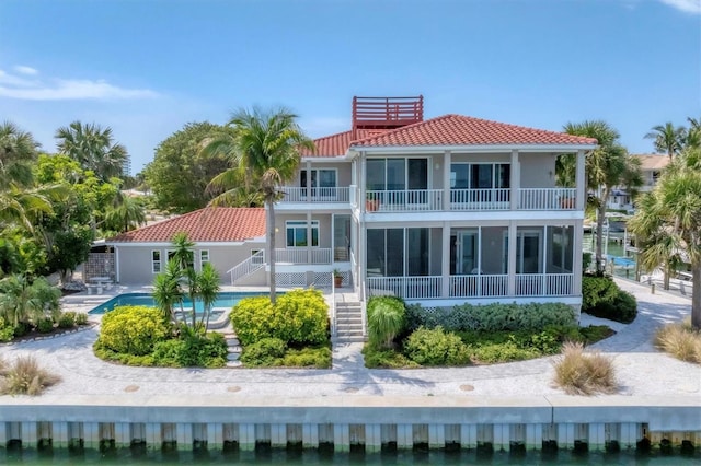 rear view of property with a balcony