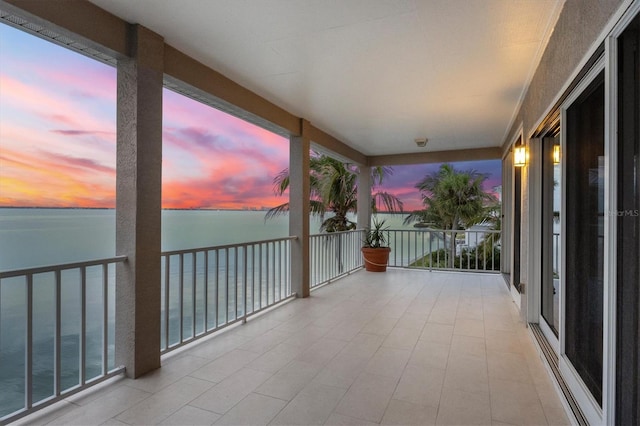 balcony at dusk with a water view