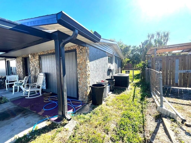 view of home's exterior with central air condition unit