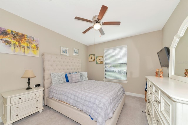 bedroom with light carpet and ceiling fan