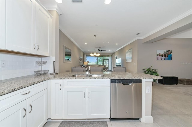 kitchen featuring kitchen peninsula, stainless steel dishwasher, ceiling fan, sink, and white cabinetry