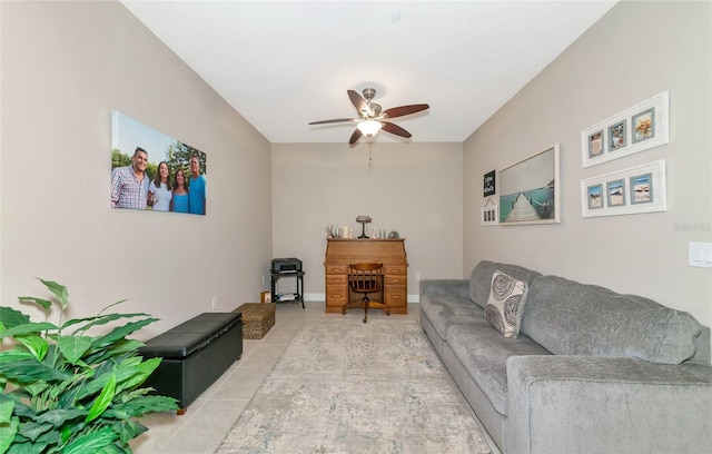 living room featuring ceiling fan and light tile patterned flooring