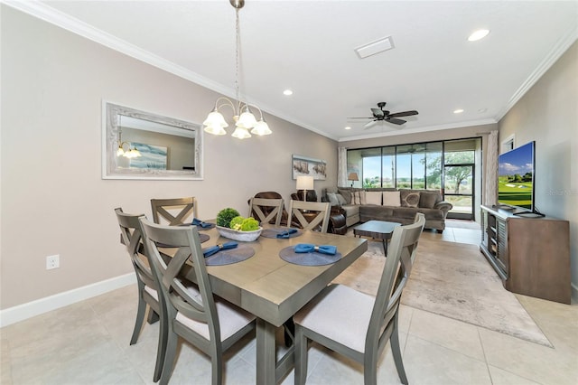 tiled dining area featuring ceiling fan with notable chandelier and ornamental molding