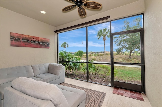 sunroom / solarium with ceiling fan