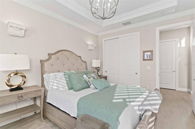 bedroom featuring a closet, ornamental molding, and a notable chandelier