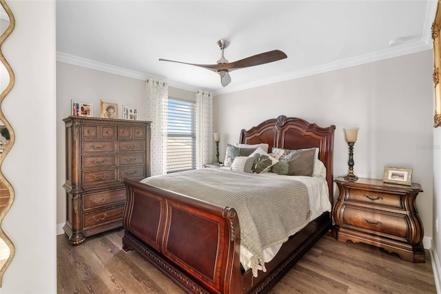 bedroom with ceiling fan, ornamental molding, and hardwood / wood-style flooring