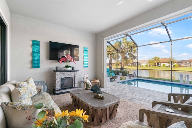 view of pool with a stone fireplace