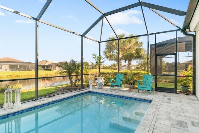 view of swimming pool with a lanai, a patio area, and a water view