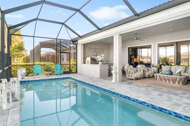 view of pool featuring a lanai, area for grilling, ceiling fan, and a patio