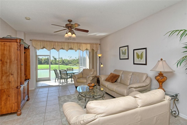 tiled living room featuring a textured ceiling and ceiling fan