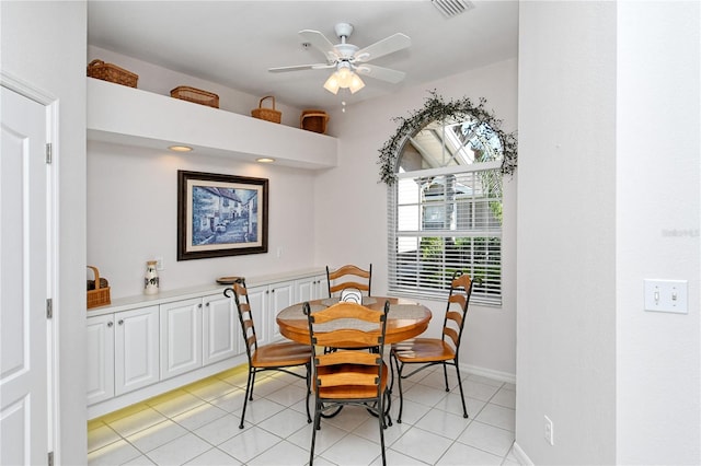 dining area featuring ceiling fan and light tile patterned flooring