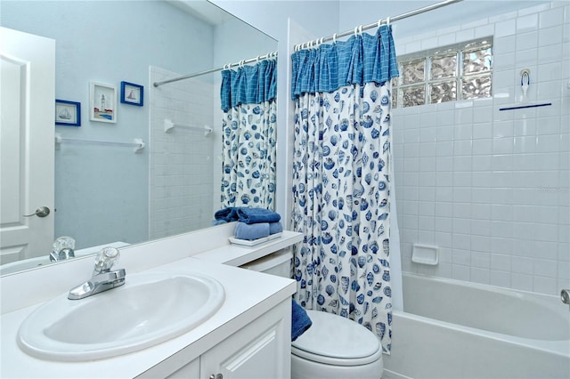 full bathroom featuring vanity, toilet, and shower / bathtub combination with curtain