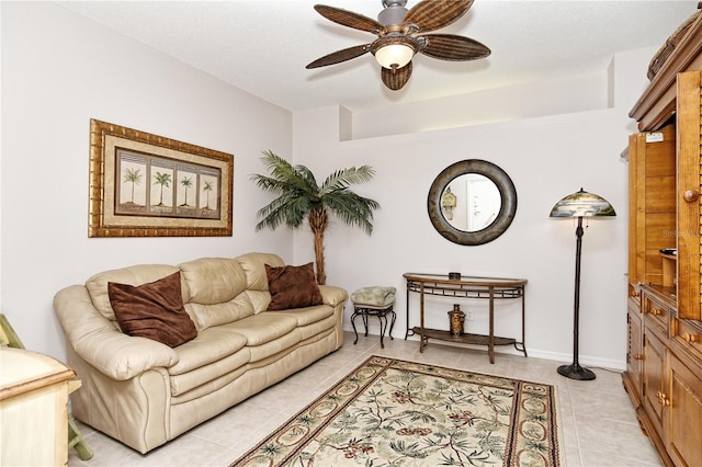 living room with light tile patterned floors and ceiling fan