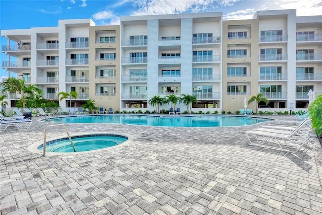 view of pool featuring a hot tub