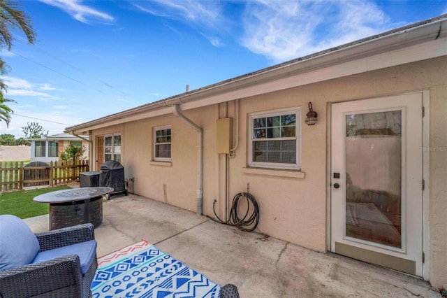 rear view of property featuring a patio