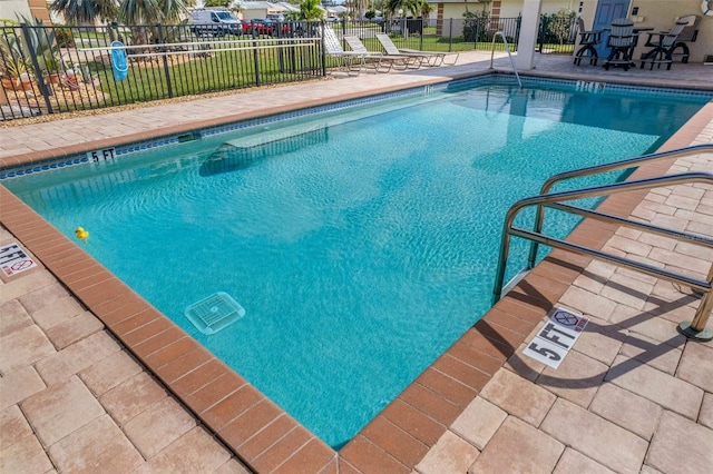 view of swimming pool with a patio area