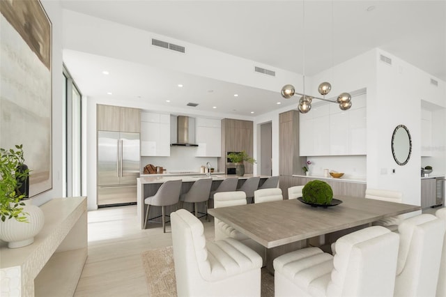 dining room featuring a chandelier and sink