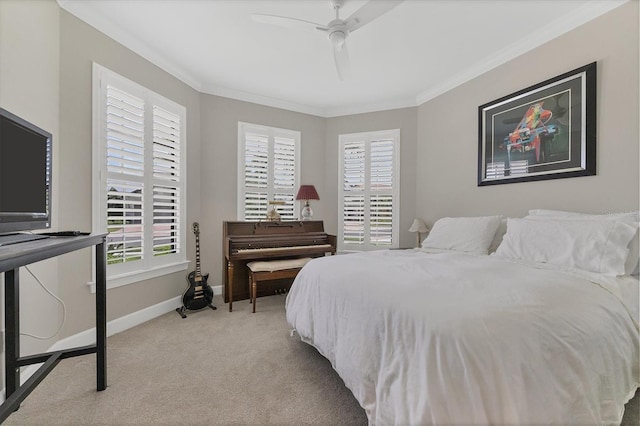 bedroom featuring ceiling fan, crown molding, and light carpet