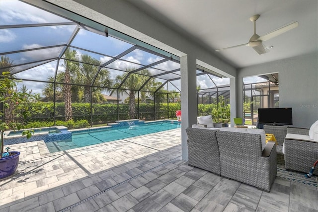 view of swimming pool with a lanai, a patio area, an in ground hot tub, and ceiling fan