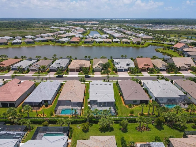 drone / aerial view with a water view