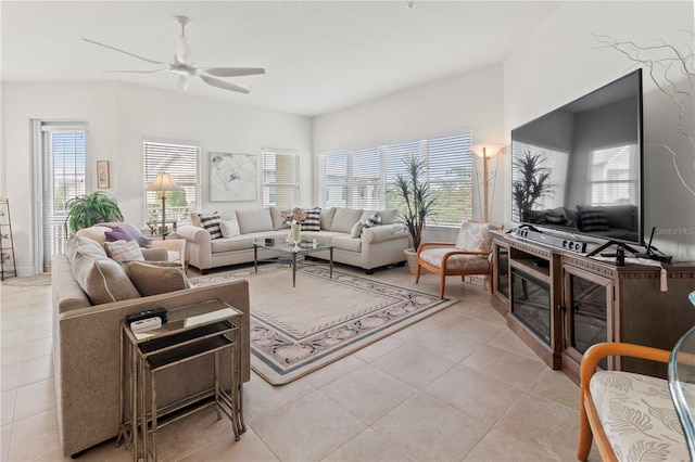 living room featuring ceiling fan and light tile patterned floors