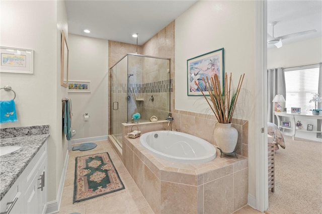 bathroom with tile patterned flooring, shower with separate bathtub, vanity, and ceiling fan