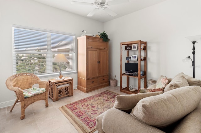 tiled living room with ceiling fan