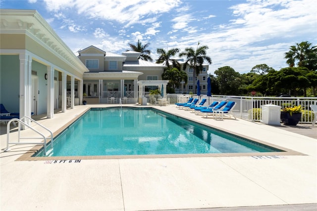 view of swimming pool with a patio area