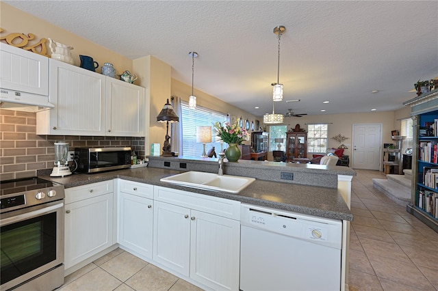 kitchen with white cabinets and appliances with stainless steel finishes