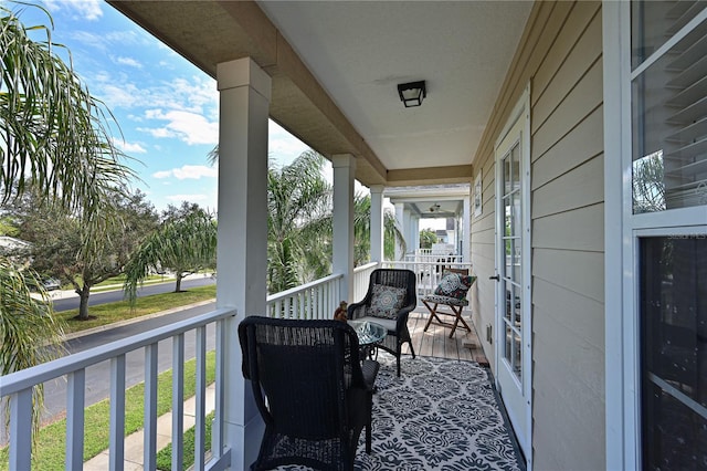 balcony featuring a porch