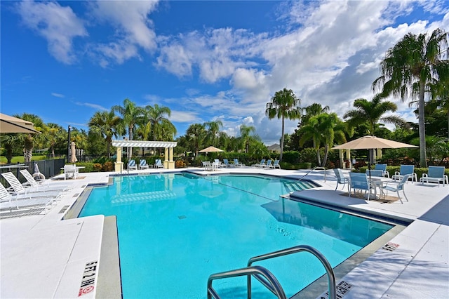 view of pool with a patio area and a pergola