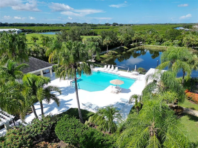 view of swimming pool with a water view and a patio