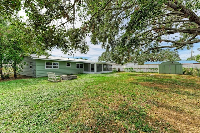 view of yard with a storage unit and a sunroom