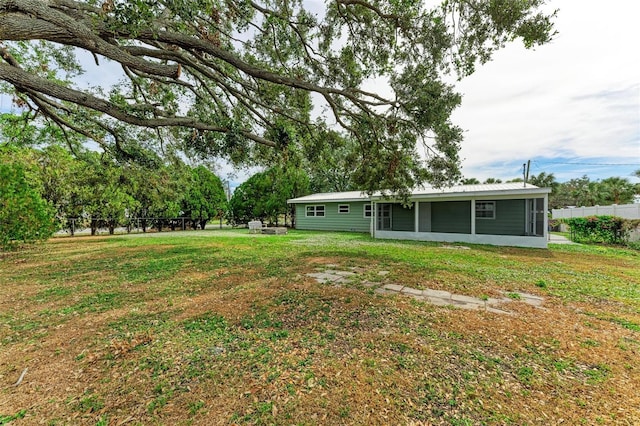 view of yard featuring a sunroom