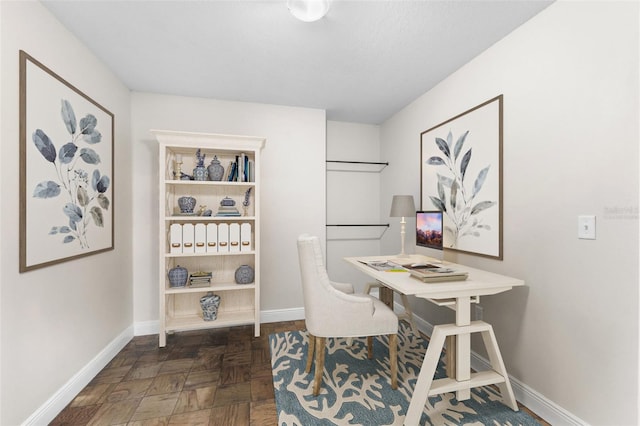 office featuring dark parquet flooring